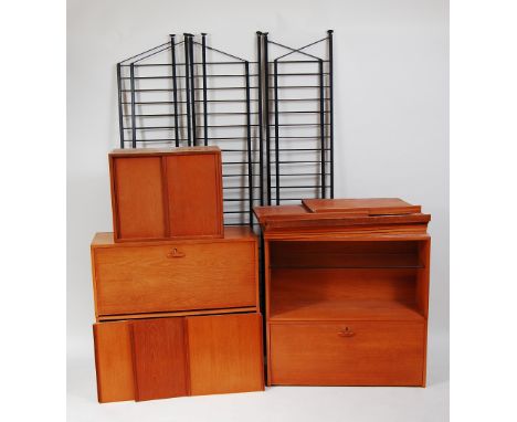 A 1970s Ladderax teak three-division wall unit, comprising two fallfront cupboards, three double door cupboards, each with sl