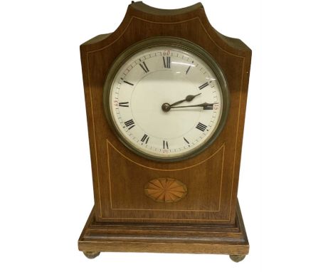 An Edwardian mahogany and inlaid mantel clock, the white enamel dial set with Roman numerals, height 22cm.