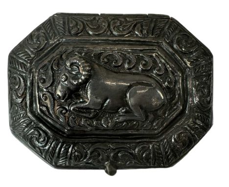 An Indian white metal snuff box of canted rectangular form and decorated with beasts, 6 x 5cm, approx 41.2g.