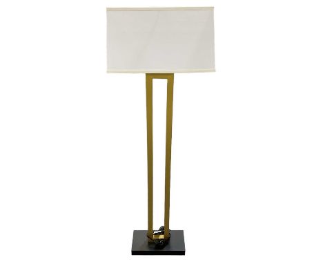 A modern contemporary gilt metal standard lamp on ebonised base, with white shade, height to top of fitment 130cm.