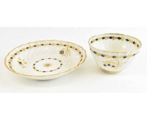 A first period Worcester gilt decorated saucer, diameter 14cm, and matching first period Worcester gilt decorated tea bowl, d