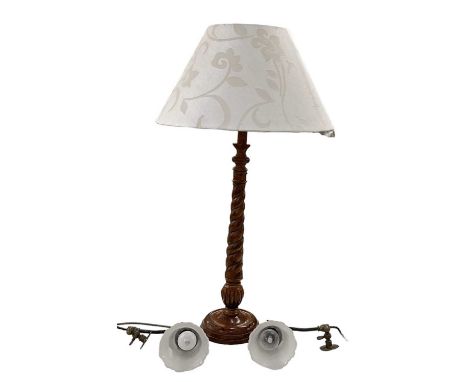 A modern walnut effect barley twist column table lamp, height to top of fitment 63cm, and two modern wall lights with frosted