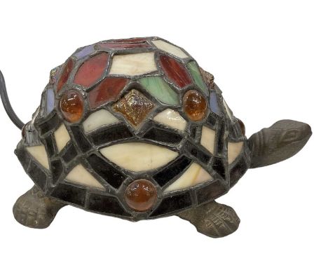 A Tiffany style bronzed metal tortoise lamp with coloured glass shade/shell, length 20cm. (af)