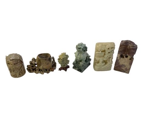 A group of Chinese carved hardstone and soapstone figures including a green hardstone Dog of Fo, height 16cm, three soapstone