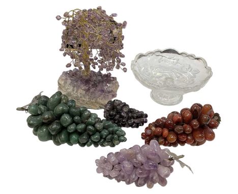 An amethyst tree with gilt metal trunk, height 20cm, and a cut glass comport with four bunches of hardstone grapes.