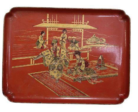 A Japanese red lacquer tray depicting a lady and gentleman sitting on a carpet, 33 x 25cm.