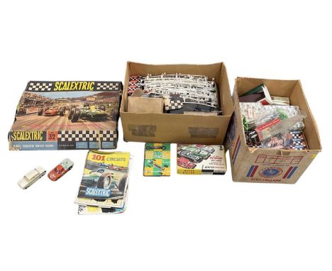 A large quantity of Scalextric track, motors, cars, electricals, buildings, models, etc.