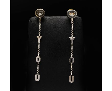 CHOPARD, A PAIR OF 'HAPPY DIAMONDS I LOVE YOU' EARRINGS. 18ct white gold, set with small round brilliant cut diamonds, pendan