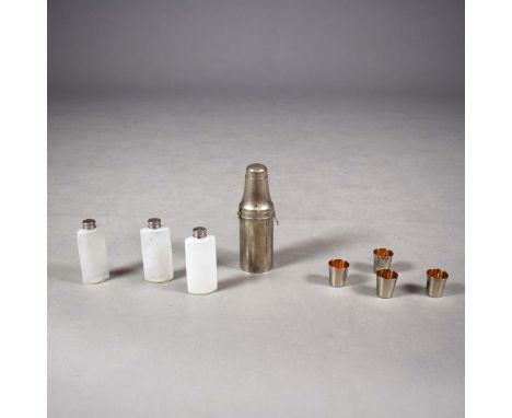 EARLY 20TH CENTURY SILVER PLATED COCKTAIL SHAKER. fitted with three internal glass bottles, with four gilt lined shot cups an