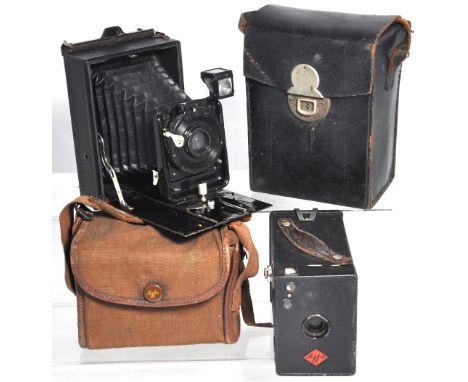 An Ernemann folding plate camera with original carry case and a small quantity of slides also an Agfa box camera and canvas c