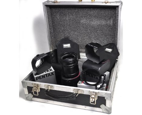 A set of Pentax 67 extension tubes in original carrying case, a quick focus ring, two lens shades, a heavy duty aluminium cam