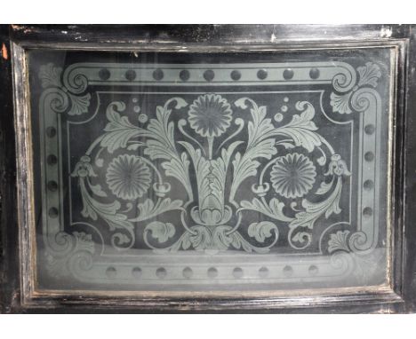 A curved etched glass window light decorated with floral sprays and a central urn, 41 x 59cm. 