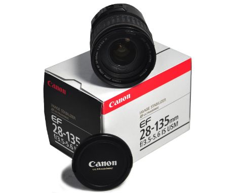 A Canon EF 28-135mm image stabilized auto focus zoom lens, boxed and mint.