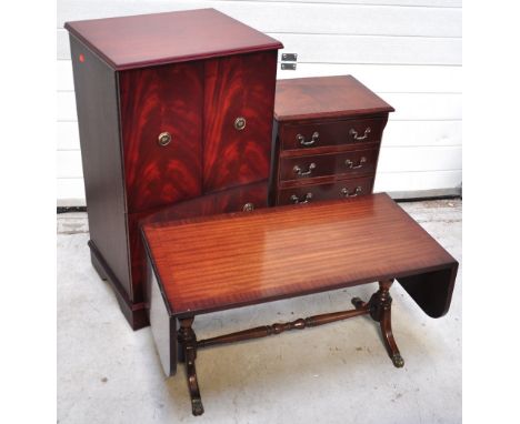 A reproduction mahogany and crossbanded bedside chest, a low reproduction sofa table and a reproduction side cabinet (3).