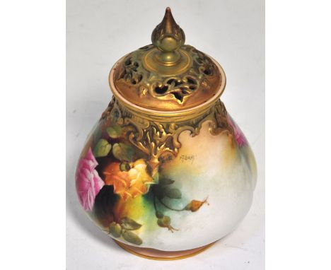 A Royal Worcester blush ivory floral painted and gilt heightened quatrolobe vase and cover signed F.J. Bray, the base with gr