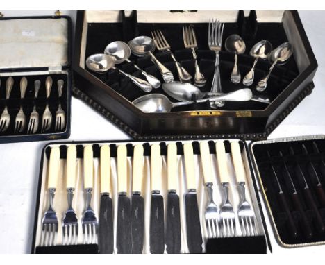 A part complete cased canteen of silver plated cutlery comprising 20 pieces of flatware, a complete cased set of silver plate