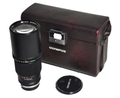 An Olympus Zuiko 300mm f4.5 telephoto lens complete with unassociated Olympus hard carrying case (2).