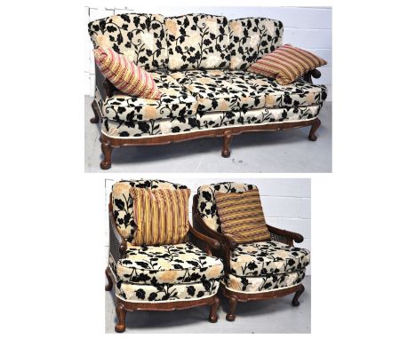 A 1930s/40s walnut framed three piece bergere suite, comprising three seat sofa and two armchairs each with cushion seat and 