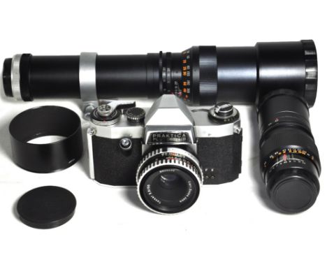 A Praktica Nova Ib SLR camera with f2.8 50mm standard lens and  case, a 200mm pre-set telephoto lens and a 400mm pre-set tele