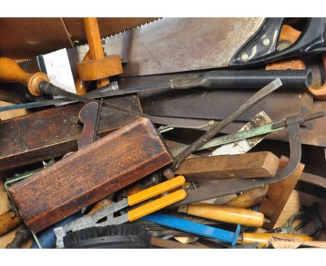 A collection of vintage woodworking tools to include hand saws, fret saws, profiling planes etc.
