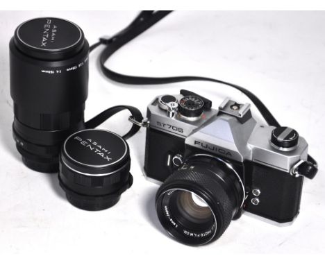 A Fujica ST705 35mm SLR camera with case and standard lens, also a Pentax SMC 135mm telephoto lens complete with hard carryin