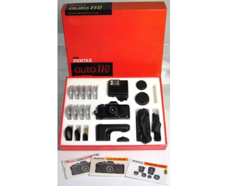 A Pentax Auto 110 miniature SLR camera outfit in presentation box, to include camera with standard lens, wide angle, telephot