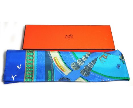 A boxed Hermes silk scarf; "Jardin Enchante" designed by Jubomir Milinkov in 1986, 90 x 90cm.