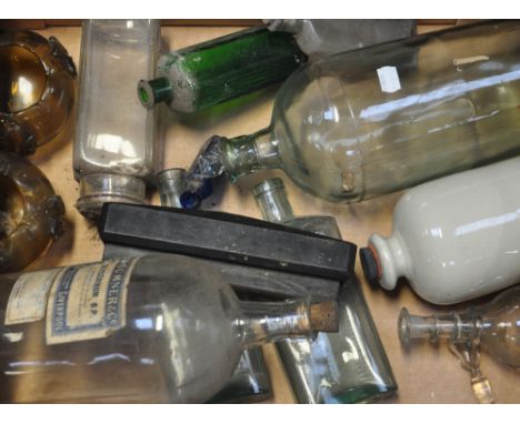 Various vintage bottles and glass bowls.