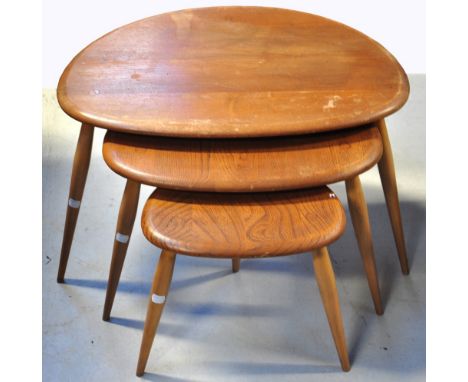 A 20th century nest of three Ercol tables on tapered legs, width of largest 67cm.