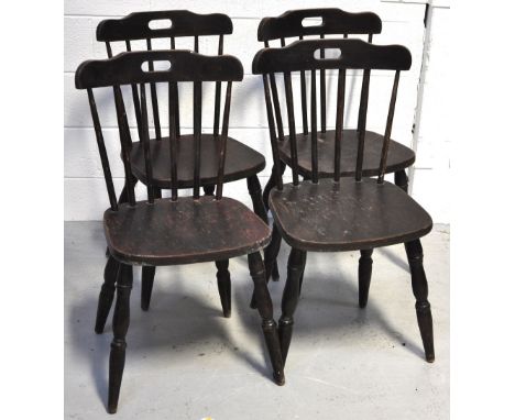 Four stick back kitchen chairs.