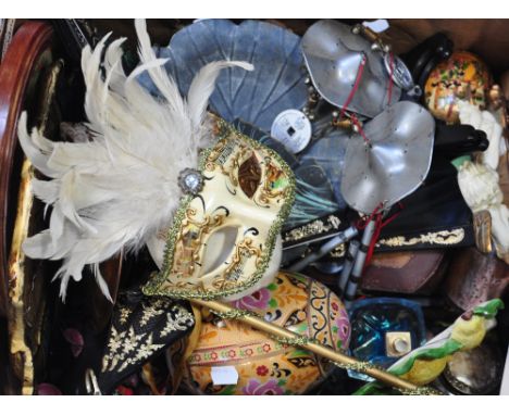 A box of collectibles to include ceramic wall masks, wind chimes, fans etc.