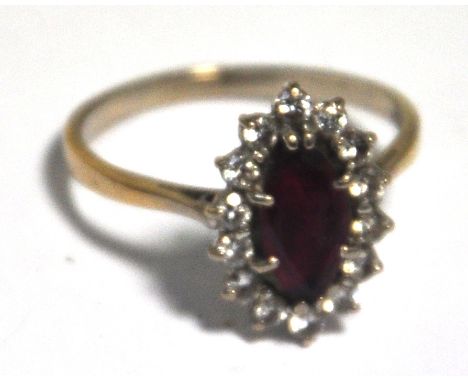 A 9ct gold ring set with central ruby surrounded by 14 diamonds, approx weight 3.6g, size S 1/2.