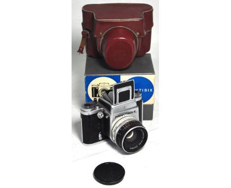 A Praktisix II medium format SLR camera complete with box and hard carrying case.