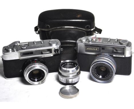 A Yashica Minister-D and a Minimatic-C camera complete with case, also a Carl Zeiss Jena Biotar f2 5.8cm bayonet fitting lens