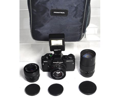 A Praktica BCA 35mm SLR camera with 50mm standard lens, 28mm wide angle lens, 135mm telephoto lens, electronic flash gun and 