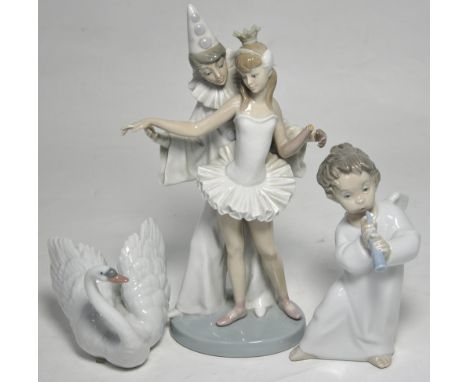 A Lladro figure of a dancing couple in costume, height 27cm (af), a Lladro figure of an angelic child playing the flute, heig