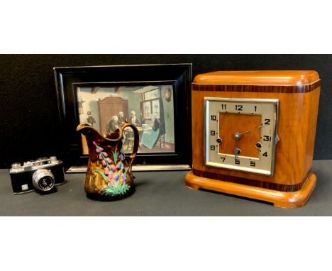 An Art Deco clock, square dial, Arabic numerals, twin winding holes, 24cm high, 24cm wide; a copper lustre jug; a camera; etc