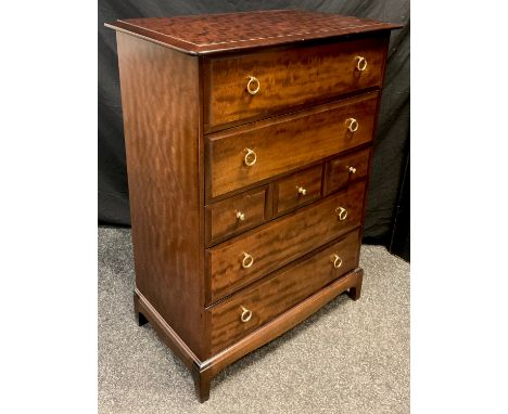 A 1970/80s Stag furniture mahogany chest of drawers, ‘Minstrel’ model, 112cm high x 82cm wide x 46.5cm;  a conforming Stag fu