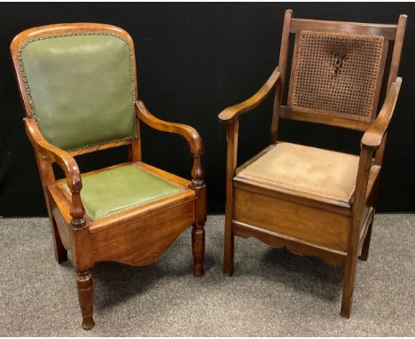 A Victorian walnut commode elbow chair, green leather upholstered back and seat, turned legs and supports, 101cm high x 53cm 