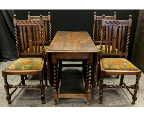 An early 20th century oak gate-leg dining table, rounded rectangular top, barley-twist supports, 73cm high x 106cm x 151cm fu