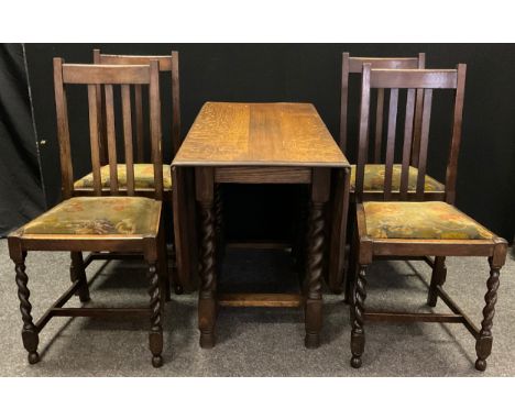 An early 20th century oak gate-leg dining table, rounded rectangular top, barley-twist supports, 71.5cm high x 106cm x 151cm 