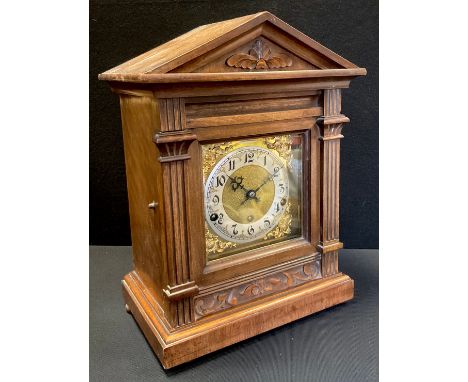 An early 20th century German Bracket clock, 31-day chiming movement, brass dial with Arabic numerals, walnut case, 41cm high 