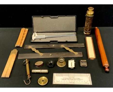 A brass leather bound three drawer telescope, unmarked, 3.6cm diameter, approx 43cm extended length;  folding rules, micromet