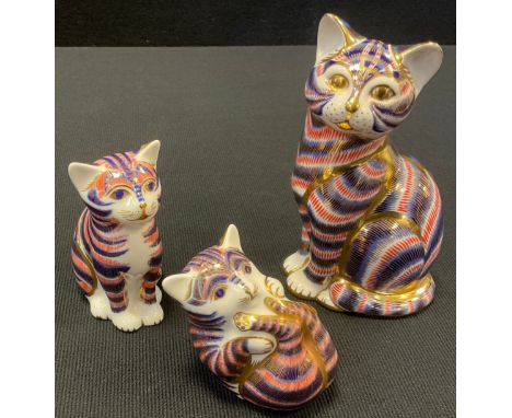 Three Royal Crown Derby paperweights, Cat, Kitten and Playful Kitten, all decorated in the Imari palate with gold stopper and