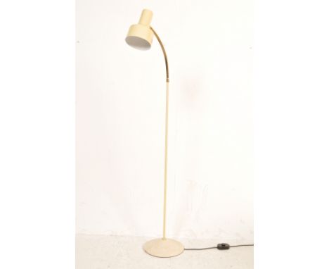 A retro vintage 20th century industrial floor standing lamp having a cream lightshade, adjustable neck raised on a circular w