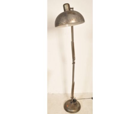 A late 20th Century industrial retro style floor standing lamp in the manner of Anglepoise Herbert Terry having a round bowl 