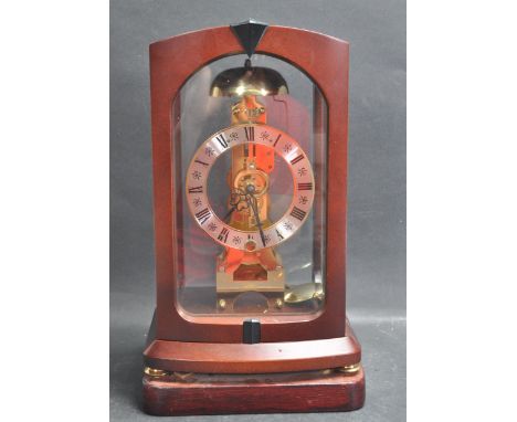 A 20th century Franz Hermle wooden cased mantle bracket clock with exposed movement and silvered chapter ring bearing roman n