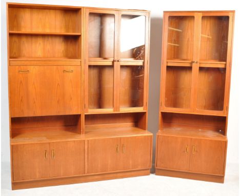 A vintage retro 20th century circa 1970’s G Plan teakwood wall unit. The modular wall unit comprising of two upright parts co