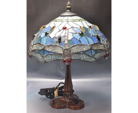 A 20th century vintage retro Tiffany style desk lamp / table lamp. The lamp having a multicolour panel glass shade raised rai