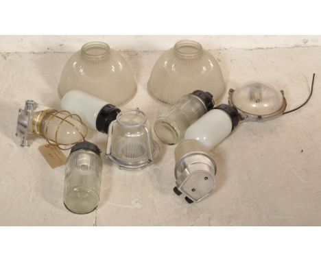 A collection of retro industrial 20th century circa 1970s industrial factory lighting to include a group of Soviet USSR pill 